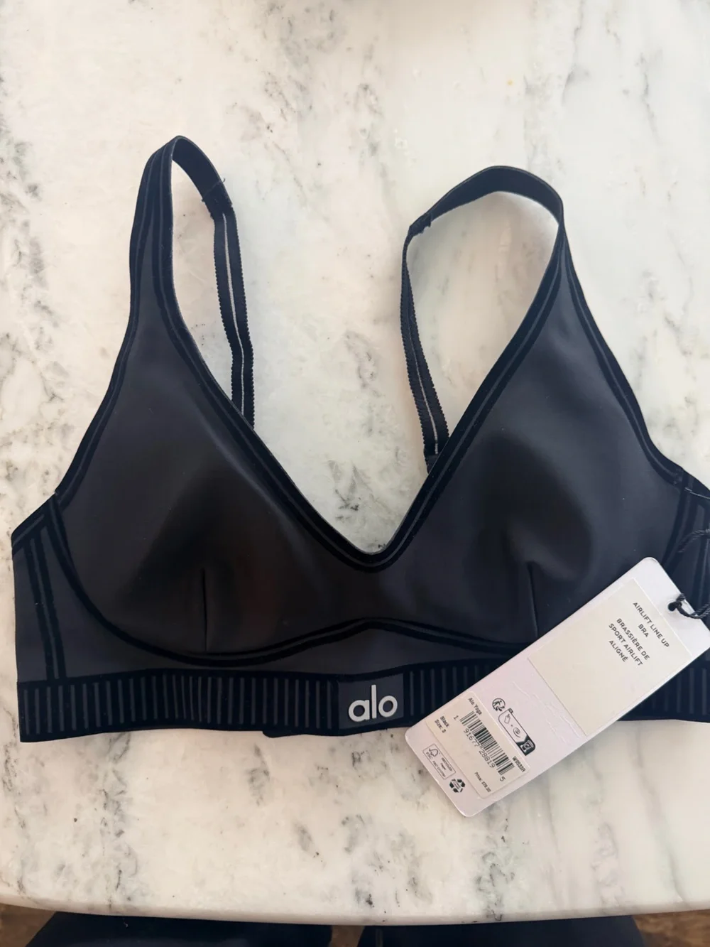 ALO Yoga Black Stripe-Trim Support Bra with matching leggings